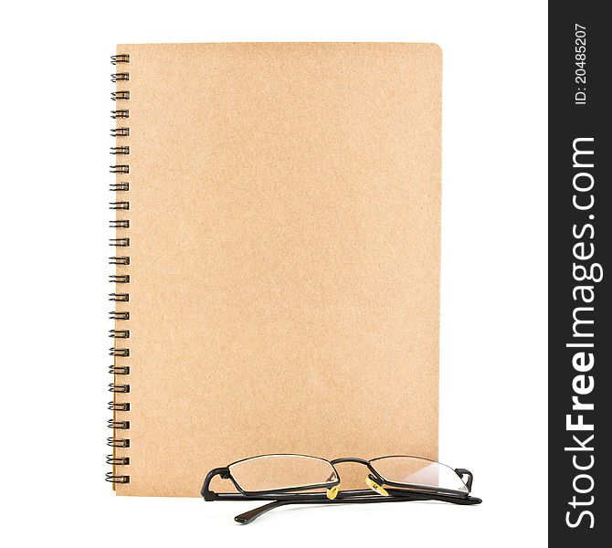 Notebook and eyeglasses isolated on white background, conservation concept. Notebook and eyeglasses isolated on white background, conservation concept