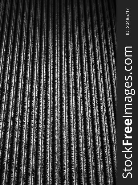 Black texture plastic with wave. closeup Useful as background for design-works.