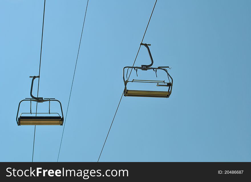 Chair lift and blue sky, shooted at Carpathians