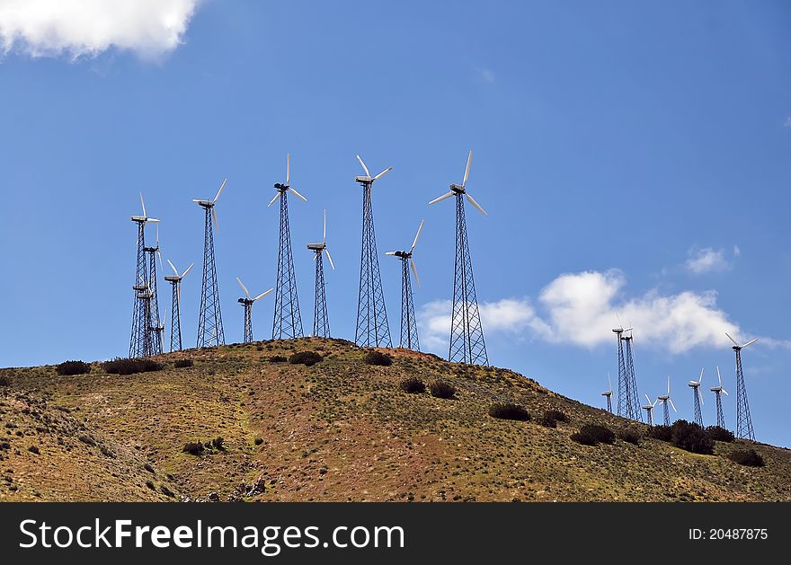 Windmill farm: Power Generating Windmills on hill. Alternative energy source. California, USA