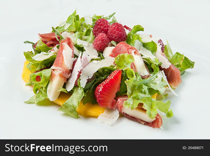 Green lettuce with a ham and cheese on a white background