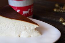 A Slice Of Cheesecake With A New Years Cup And Celebration Ornaments Stock Photos