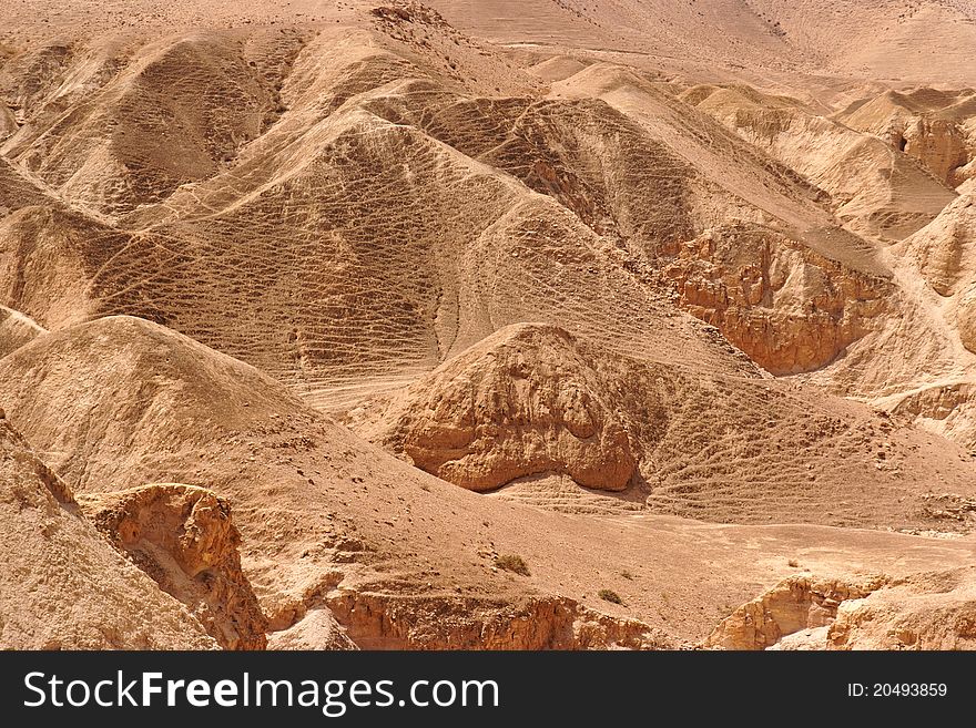 Textured orange hills in the desert. Textured orange hills in the desert