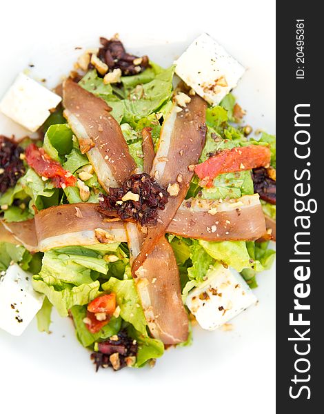 Salad with feta cheese, bacon and nuts