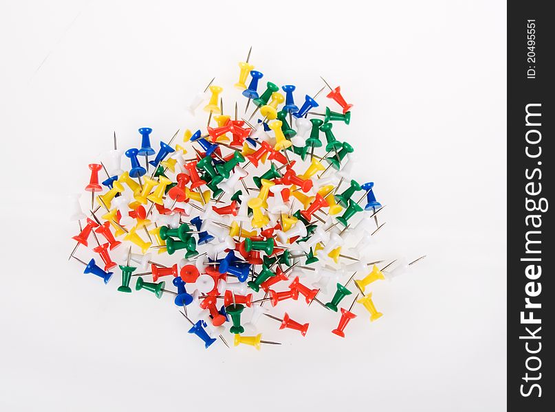 Multi Colored Push Pins on a White Background