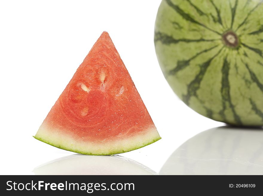 A fresh ripe watermelon  against a white background