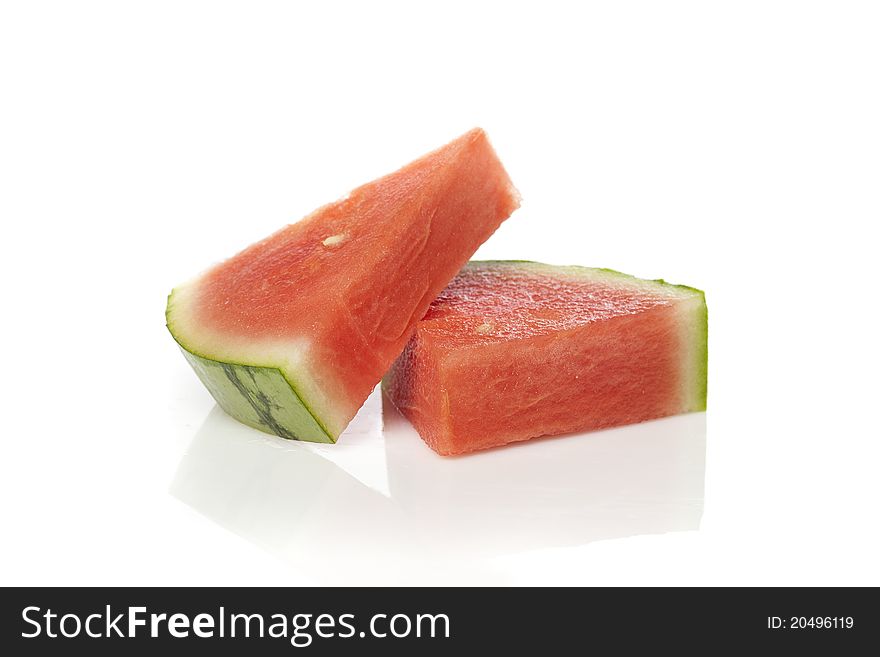 A fresh ripe watermelon against a white background