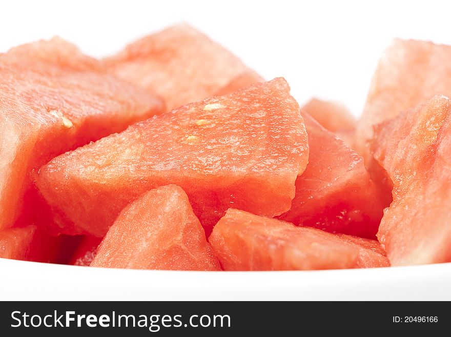 A fresh ripe watermelon isolated against a white background