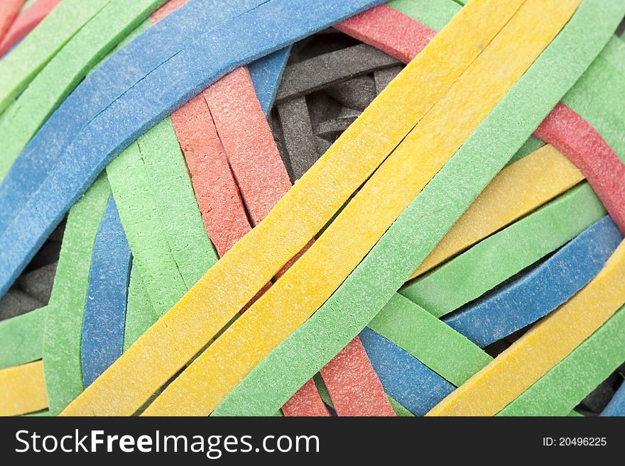 A colorful rubber band ball against a white background