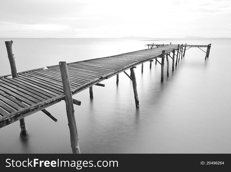Black and white picture of old bridge to the sea. Black and white picture of old bridge to the sea.