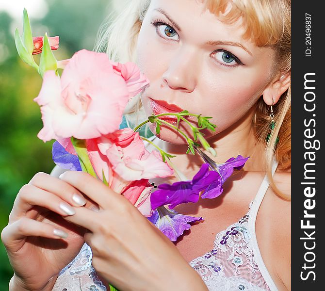 Gentle erotic woman with flowers