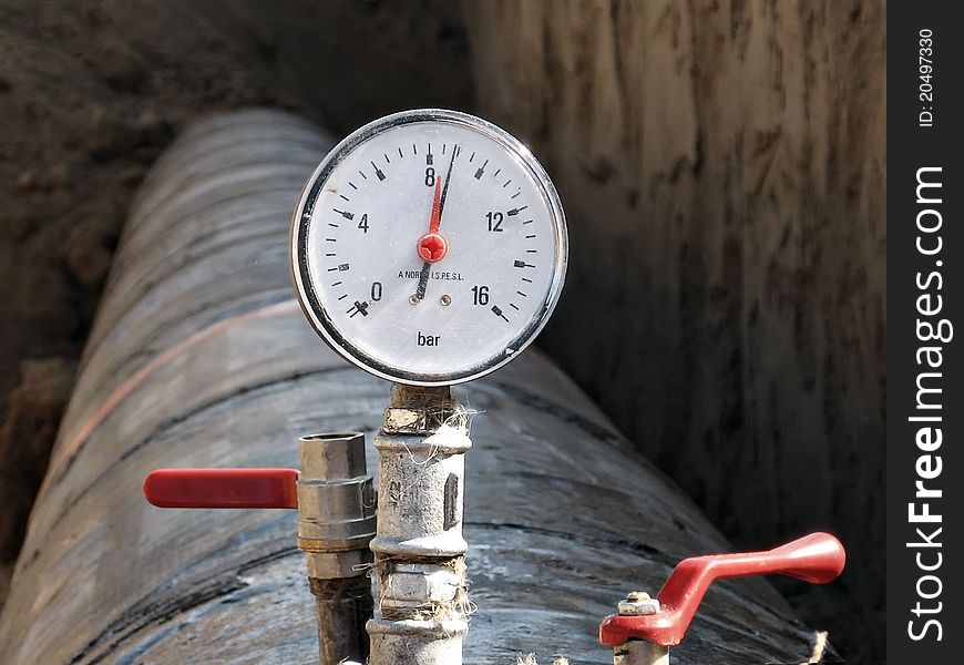 Industrial pressure meter mounted on the pipe. Industrial pressure meter mounted on the pipe