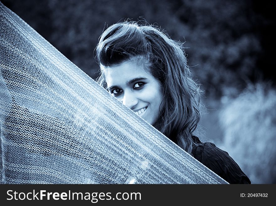 Indian model holding a traditional scarf in selenium tone. Indian model holding a traditional scarf in selenium tone