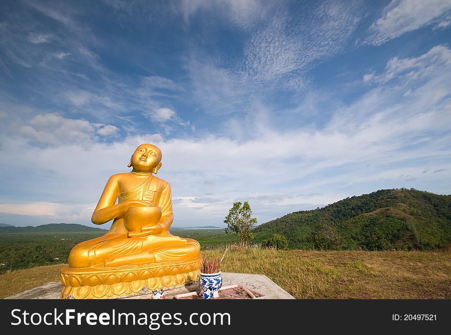 Image buddha statue on mountain with blue sky