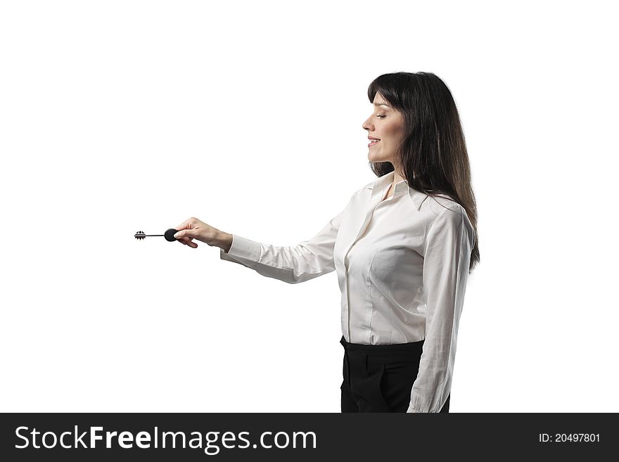 Smiling businesswoman holding a key. Smiling businesswoman holding a key