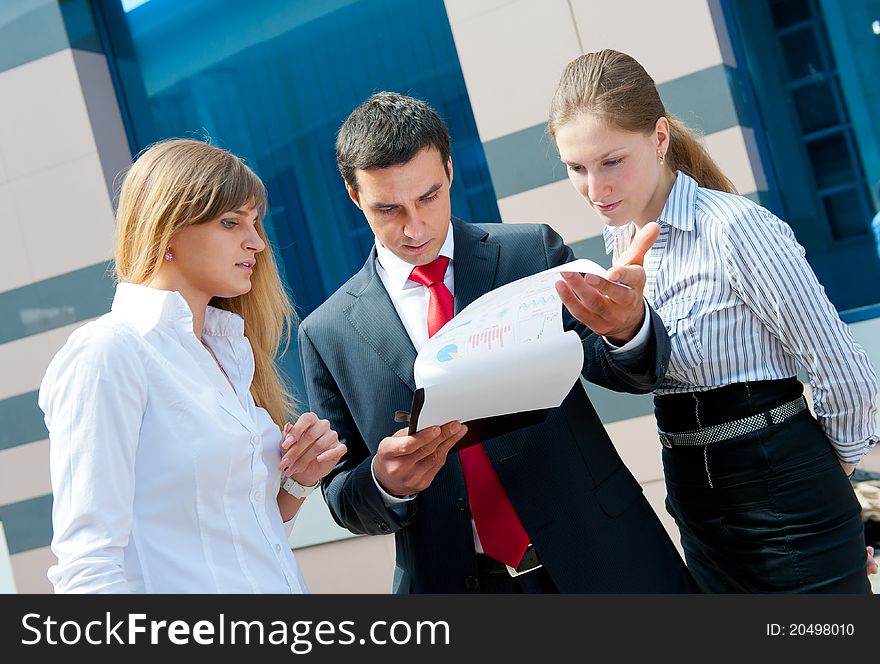 Business people meeting in a modern downtown.