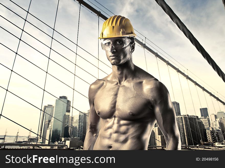 Handsome worker with cityscape in the background