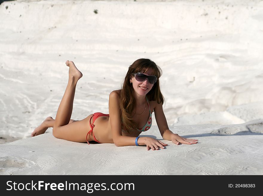 Woman relaxes in pamukkale. It is a natural site in Denizli Province in southwestern Turkey