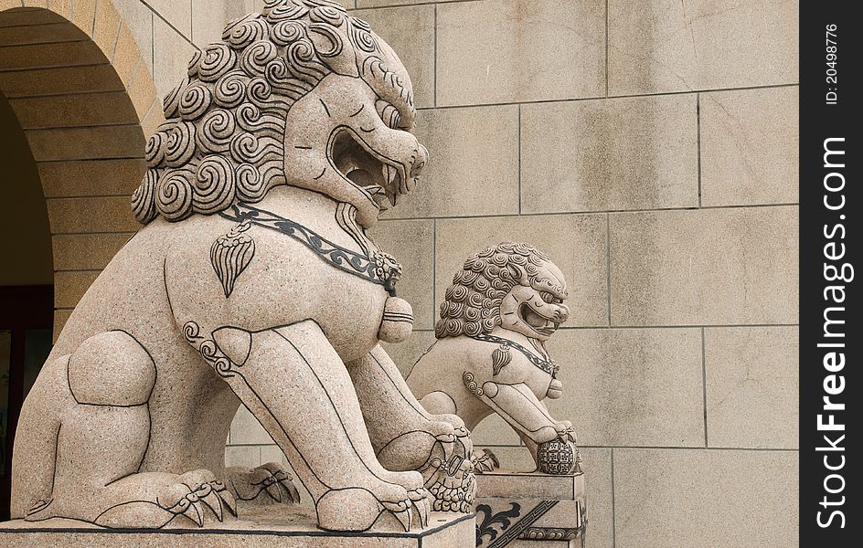 Lion statue in fron of Chinese temple