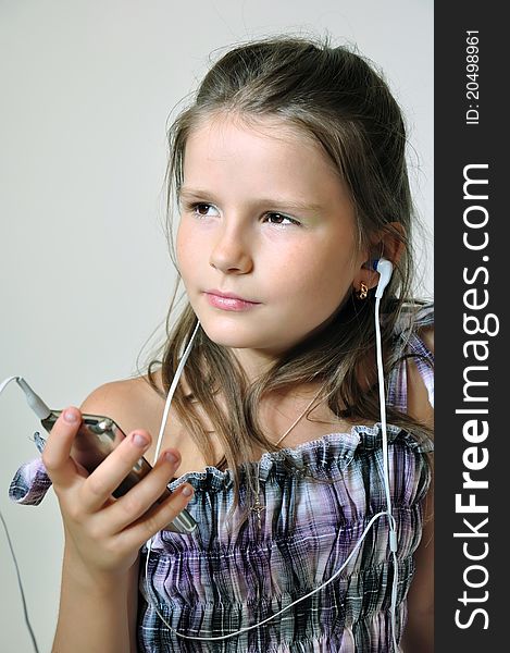 Child enjoying christian music through headphones.