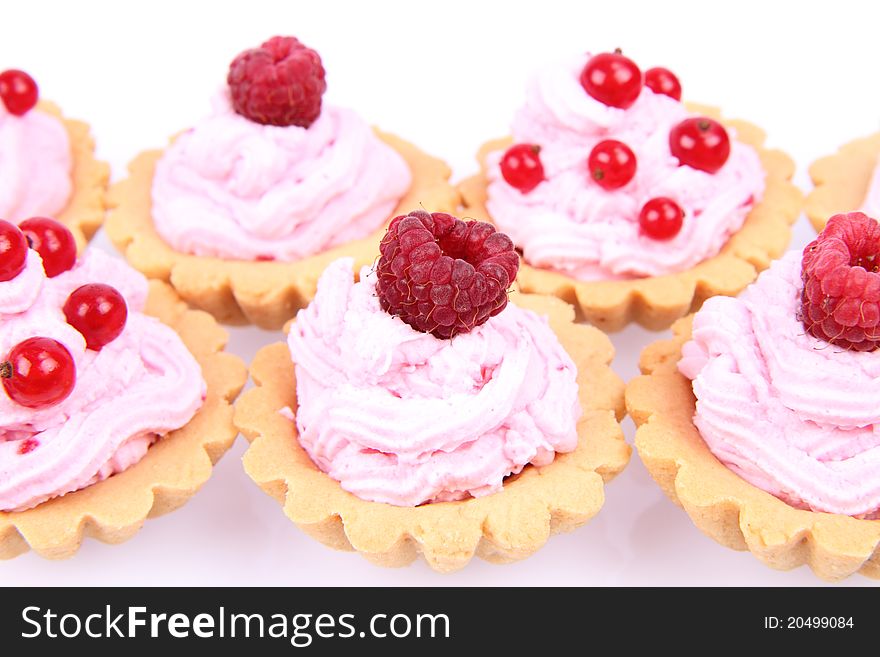 Tartlets with whipped cream and fruits - raspberries and redcurrants