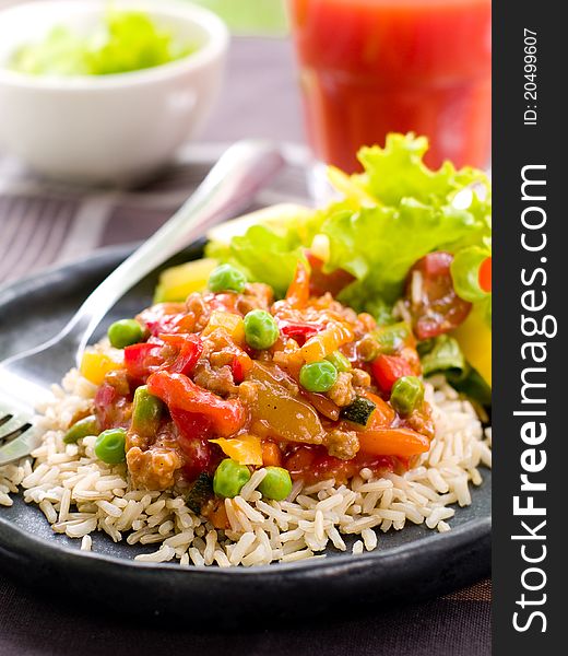Delicious rice with vegetables  and parsley. Selective focus