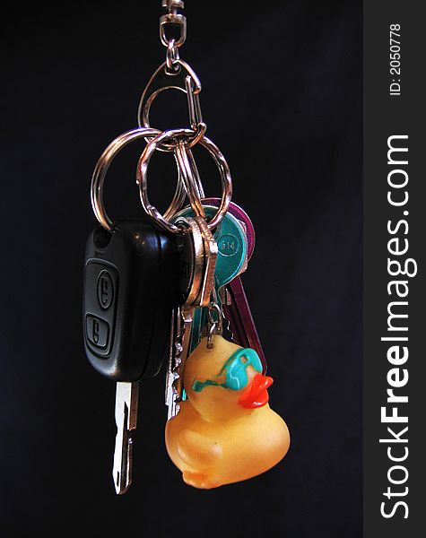 Carry-key with house key and car key and a little yellow duck