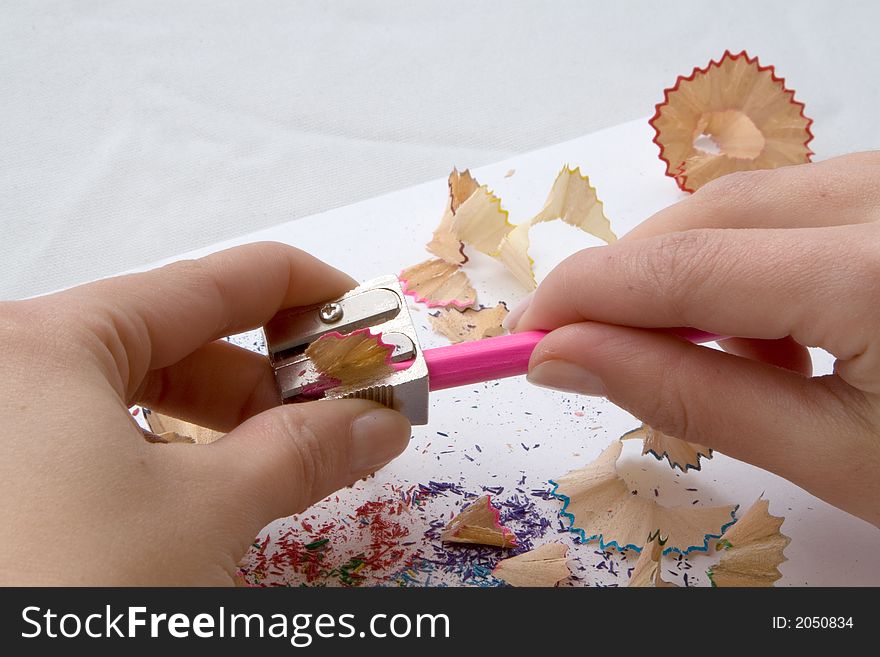 Girl S Hand While Sharpening A Pink Pencil