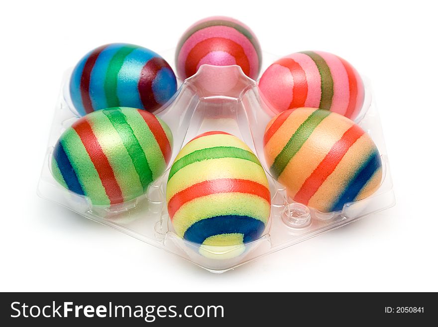 Several colored eggs arranged on a white background. Several colored eggs arranged on a white background.