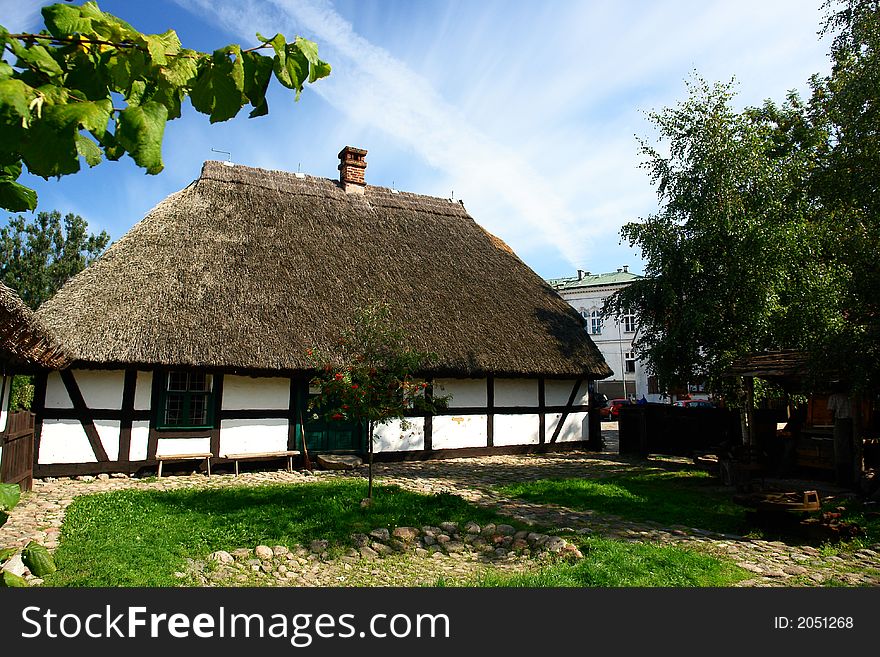 Traditional Polish checked houses, straw roofs. Traditional Polish checked houses, straw roofs.