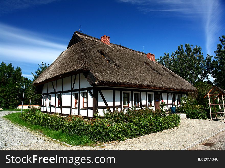 Traditional Polish checked houses, straw roofs. Traditional Polish checked houses, straw roofs.