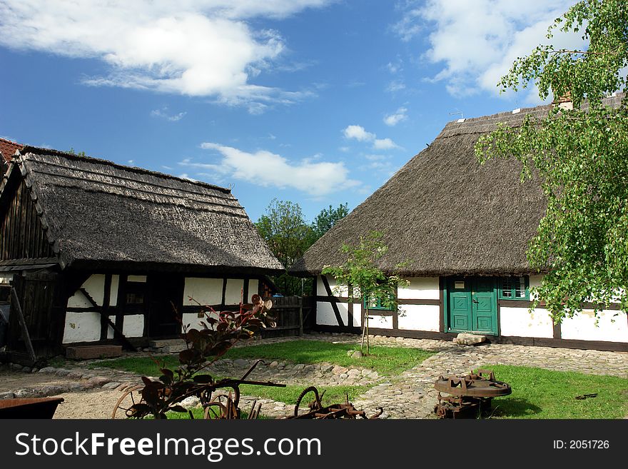 Traditional Polish checked houses, straw roofs. Traditional Polish checked houses, straw roofs.