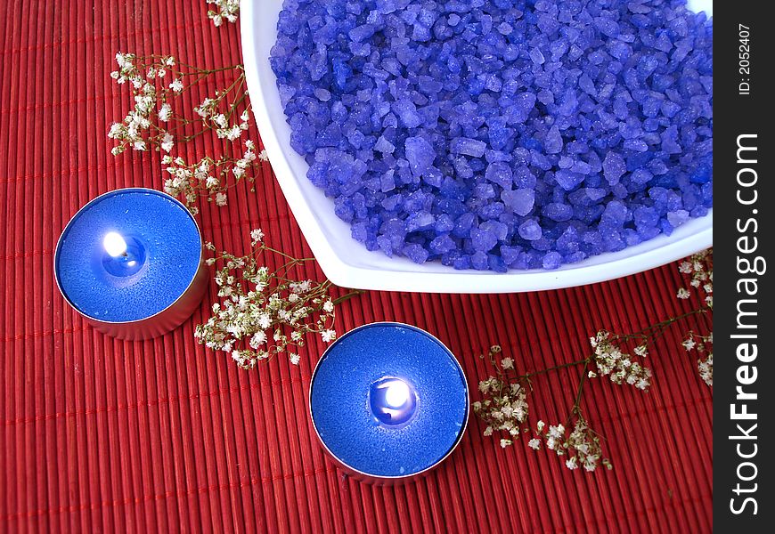Spa essentials (blue salt, candle and flower)