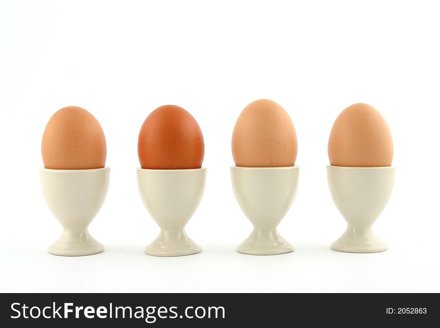 Brown eggs on white background