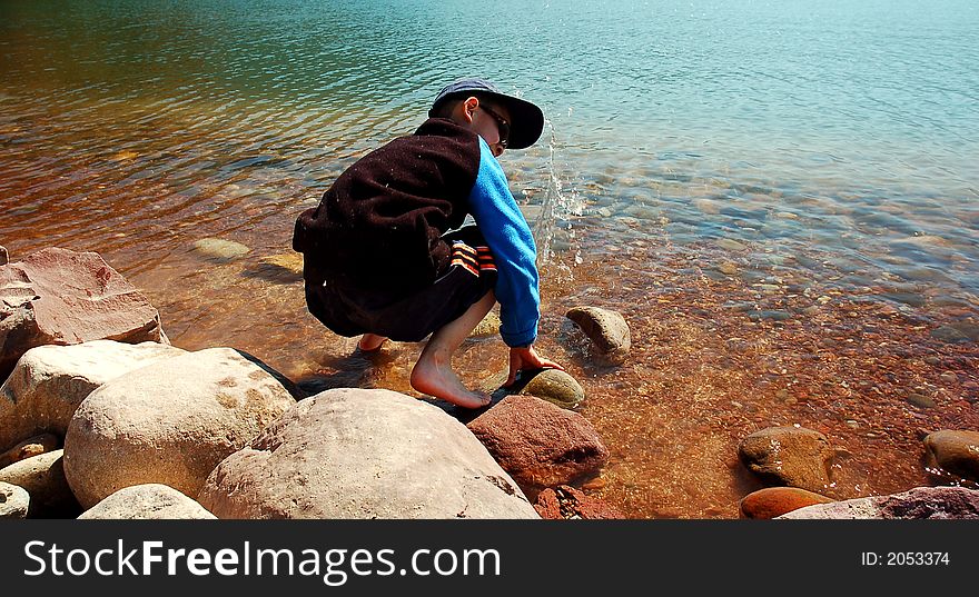 A boy play on the beach at Sichuan,west of China. A boy play on the beach at Sichuan,west of China