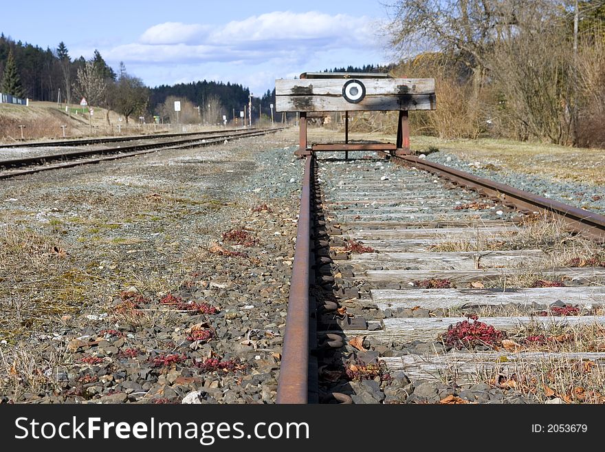 A photo of the end of a railway line (symbolic) shallow dof. A photo of the end of a railway line (symbolic) shallow dof