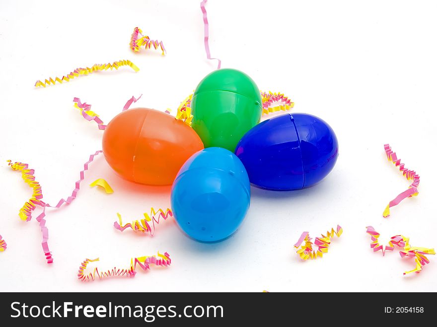 Colorful plastic eggs on a festive background