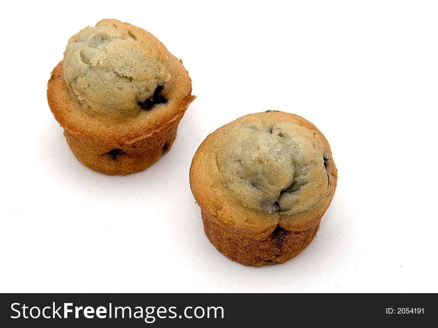 Two fresh baked blueberry muffins. Two fresh baked blueberry muffins