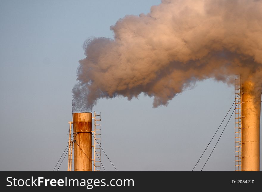 Puff of smoke from smokestack