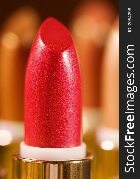 Close-up of a lipstick against a color background