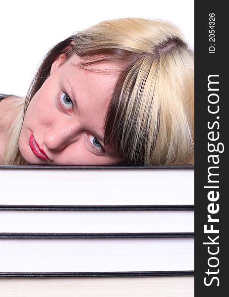 Girl head lie on stack of books. Girl head lie on stack of books