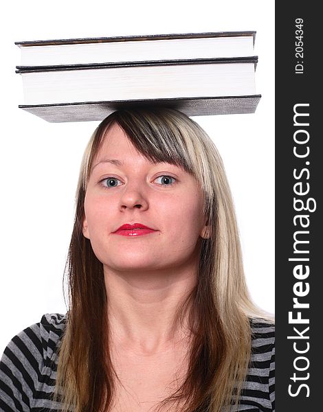 Student holing books on head. Student holing books on head