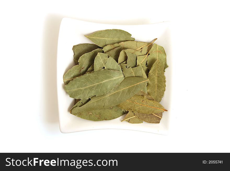 Bye leaves in square white bowl isolated