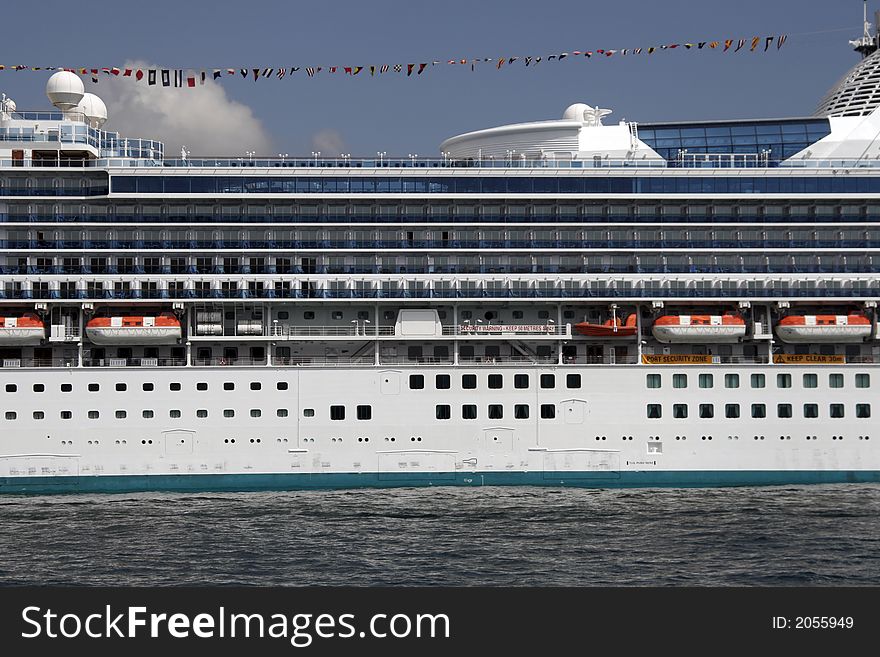 Center Part Of A Large White Cruise Ship, Cabins, Rescue Boats, Deck