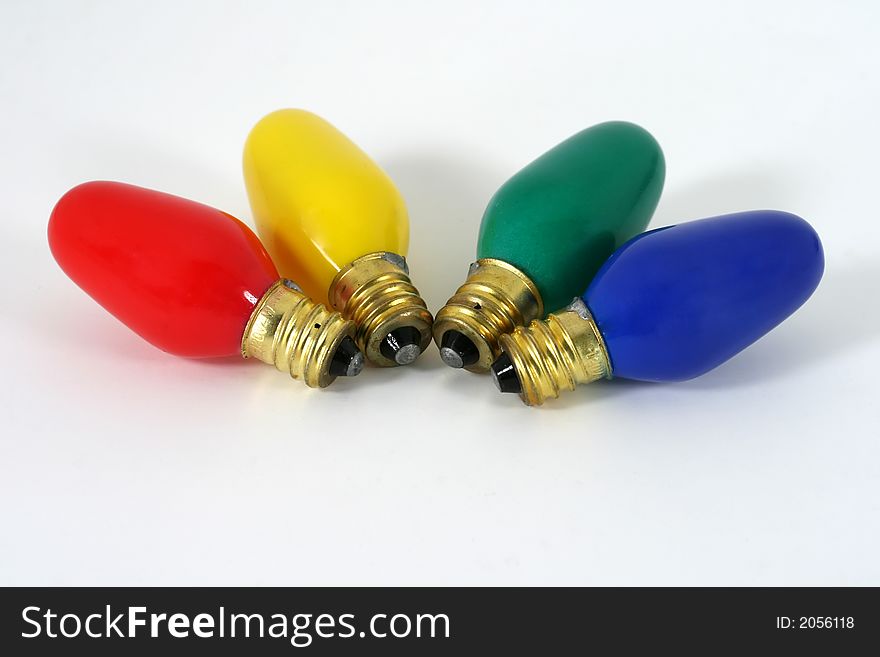 Four Christmas light bulbs in primary colors. Four Christmas light bulbs in primary colors