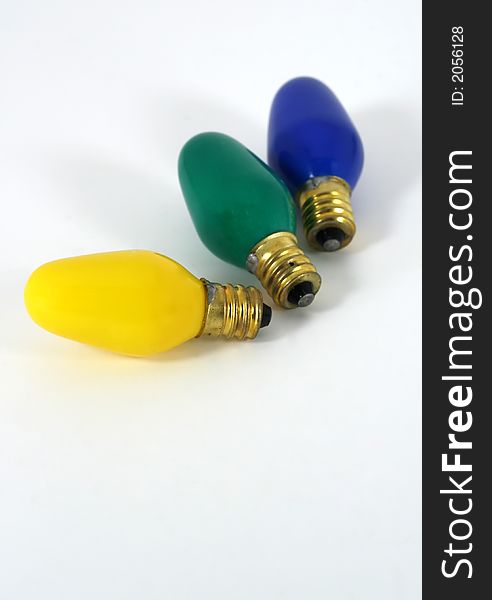 Brightly colored Christmas lightbulbs on white background. Brightly colored Christmas lightbulbs on white background