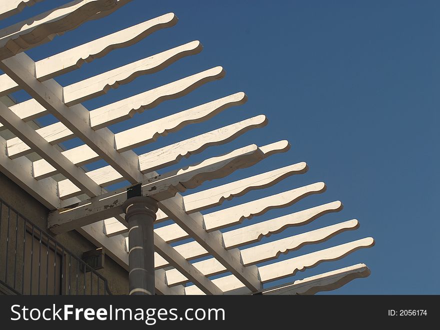 The Wooden Slates Of A Roof Against A Deep Blue Sky