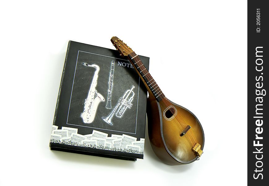 Miniature violin with notes in a theme box