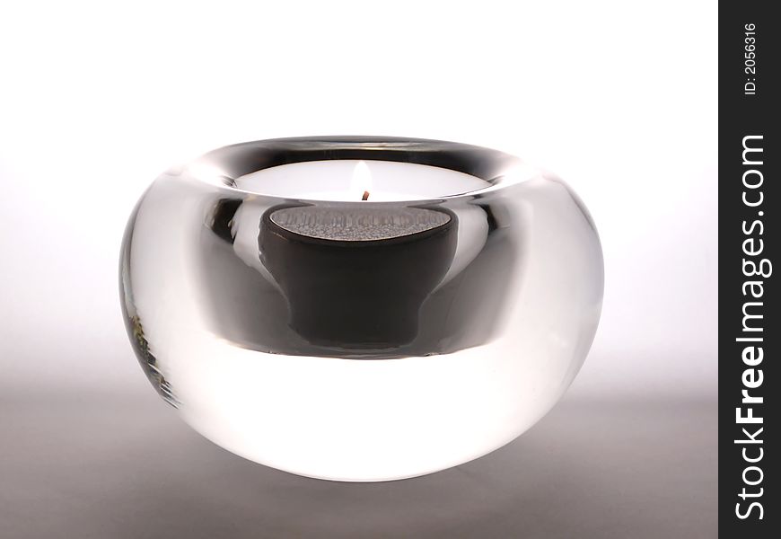 Candle lighted in design candlestick