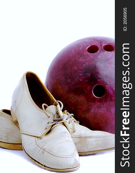 Old pair of women\'s white bowling shoes and an old bowling ball. Old pair of women\'s white bowling shoes and an old bowling ball.